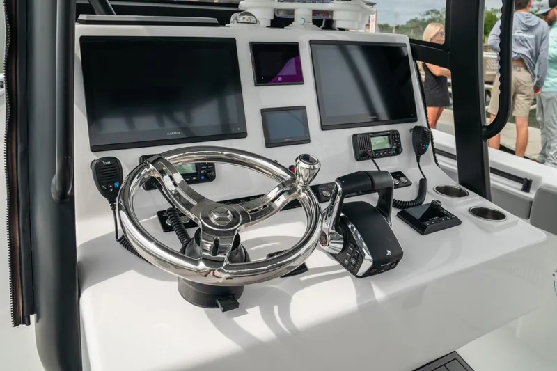 Slide: The Image of 2026 Front Runner 33' Center Console boat dashboard with modern controls and displays. - 7
