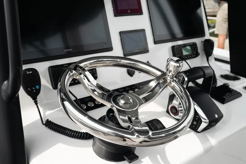 Slide: The Image of Steering console of 2026 Front Runner 33' Center Console boat with advanced navigation systems. - 9