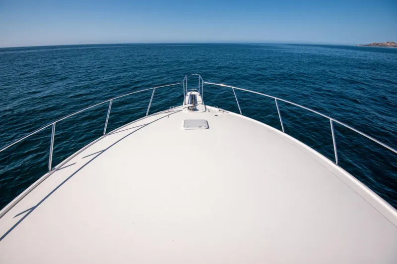 Slide: The Image of Bow view of 2017 Viking 48 Convertible yacht on open sea. - 21