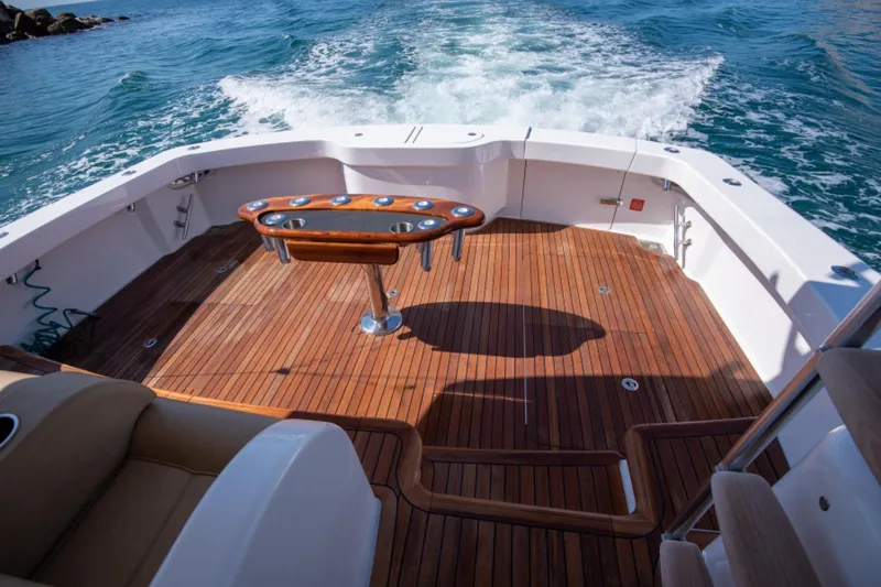 Slide: The Image of Viking 48 Convertible 2017 yacht deck with teak flooring and ocean view. - 23