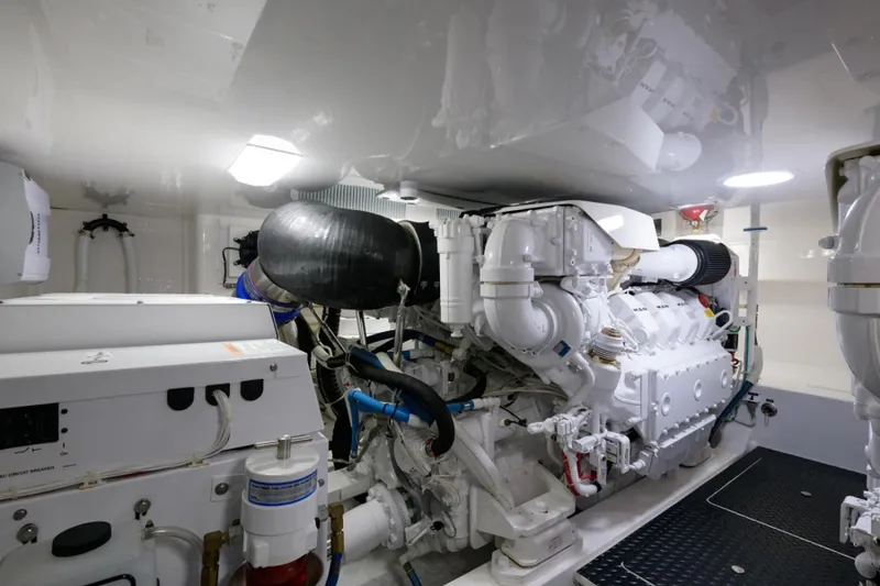 Slide: The Image of Engine room of 2017 Viking 48 Convertible yacht, showcasing powerful machinery and clean design. - 28