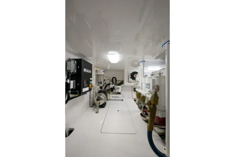 Slide: The Image of Engine room of 2017 Viking 48 Convertible yacht, featuring modern equipment and clean layout. - 30