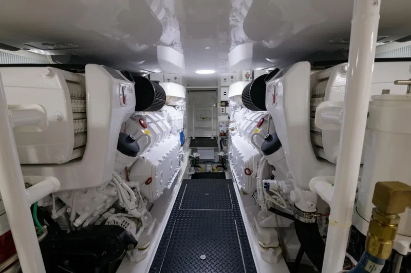 Slide: The Image of Engine room of 2017 Viking 48 Convertible yacht, showcasing dual engines and mechanical systems. - 35