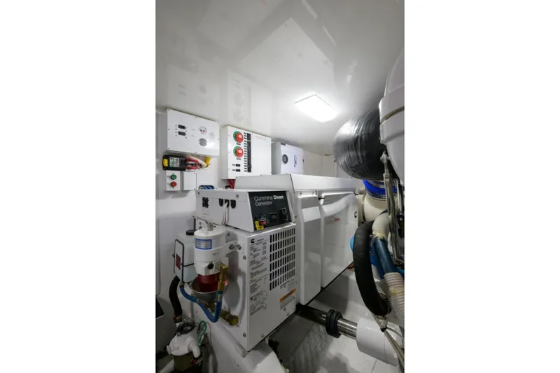 Slide: The Image of Engine room of 2017 Viking 48 Convertible yacht with Cummins Onan generator. - 36
