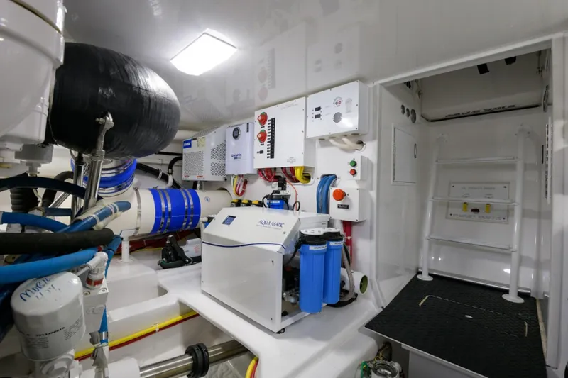 Slide: The Image of Engine room of 2017 Viking 48 Convertible yacht with advanced equipment and systems. - 37