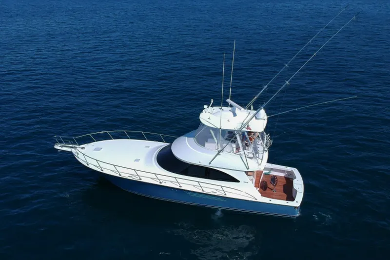 Slide: The Image of 2017 Viking 48 Convertible yacht on open sea, aerial view. - 38