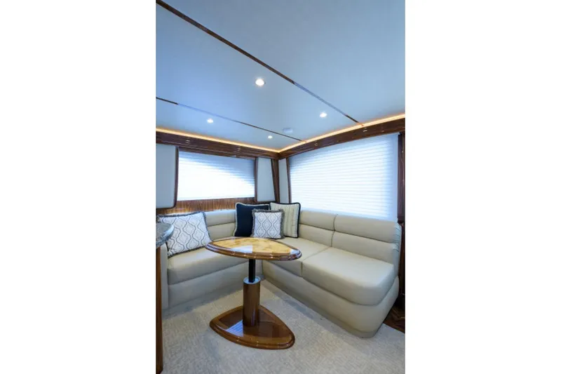 Slide: The Image of Luxurious interior of 2017 Viking 48 Convertible yacht with plush seating and elegant table. - 4