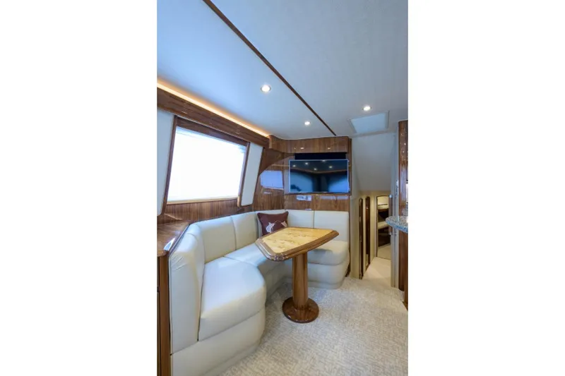 Slide: The Image of Luxurious interior of 2017 Viking 48 Convertible yacht with plush seating and elegant wood finishes. - 6