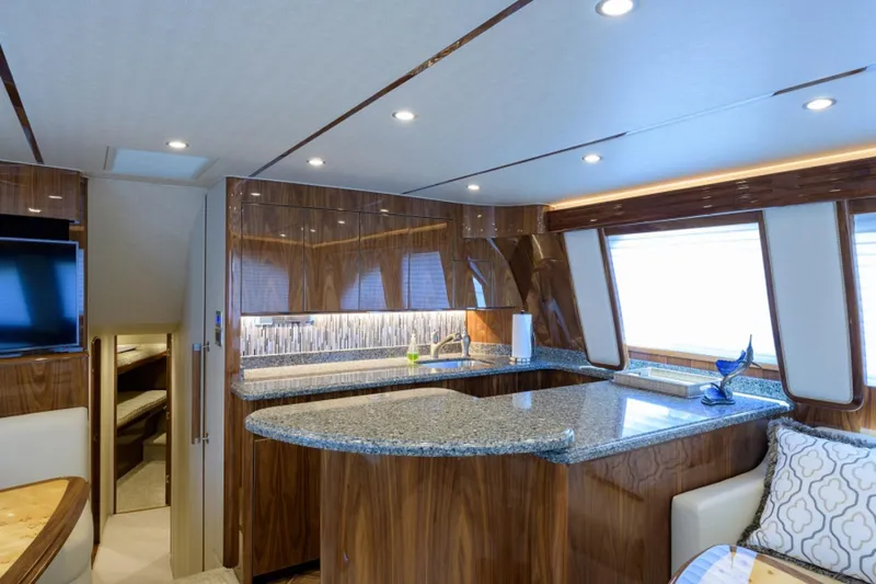 Slide: The Image of Luxurious interior of 2017 Viking 48 Convertible yacht with modern kitchen and elegant wood finishes. - 7