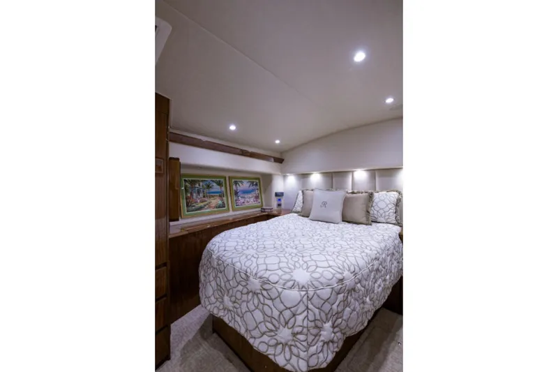 Slide: The Image of Luxurious bedroom interior of 2017 Viking 48 Convertible yacht with elegant bedding and artwork. - 9