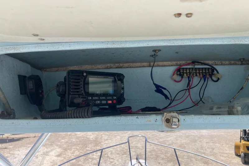 Slide: The Image of 1997 Pro-Line 255 boat electronics compartment with radio and wiring. - 12