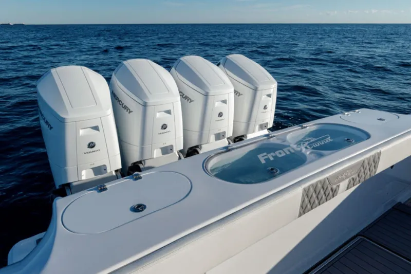 Slide: The Image of 2026 Front Runner 47' Center Console with four Mercury outboard engines on open sea. - 11