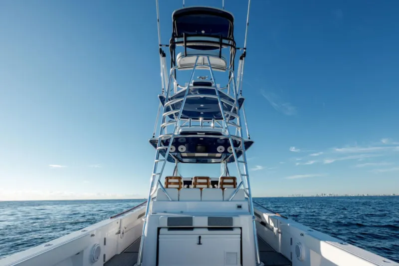 Slide: The Image of 2026 Front Runner 47' Center Console boat on open sea under clear blue sky. - 12