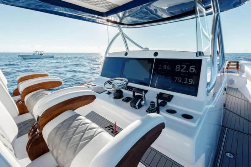 Slide: The Image of 2026 Front Runner 47' Center Console boat interior with advanced navigation displays. - 15