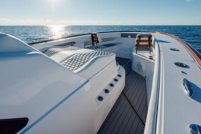 Slide: The Image of 2026 Front Runner 47' Center Console boat on open sea, sunlit deck view. - 17