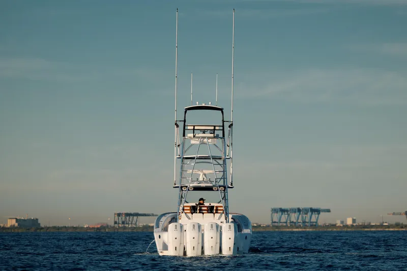 Slide: The Image of 2026 Front Runner 47' Center Console boat on open water, rear view. - 4