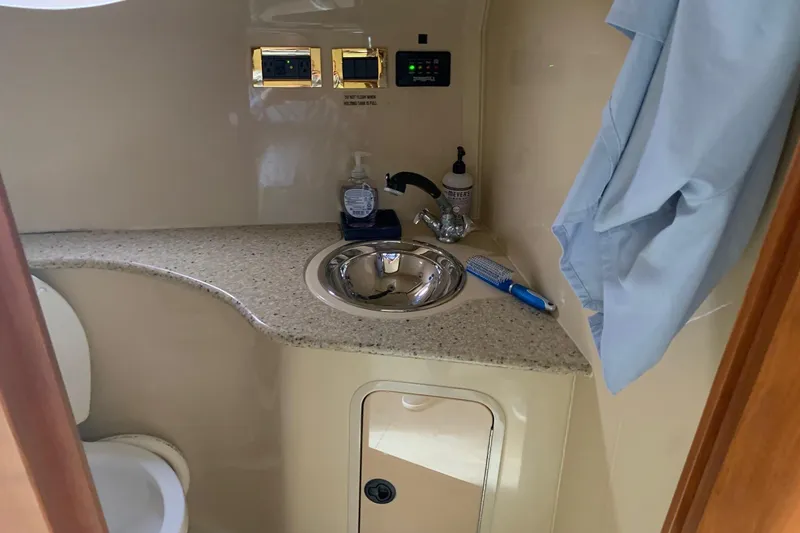 Slide: The Image of 2002 Cruisers 3275 Express bathroom with sink, countertop, and toiletries. - 31