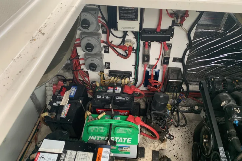 Slide: The Image of Engine compartment of a 2002 Cruisers 3275 Express with batteries and wiring. - 7