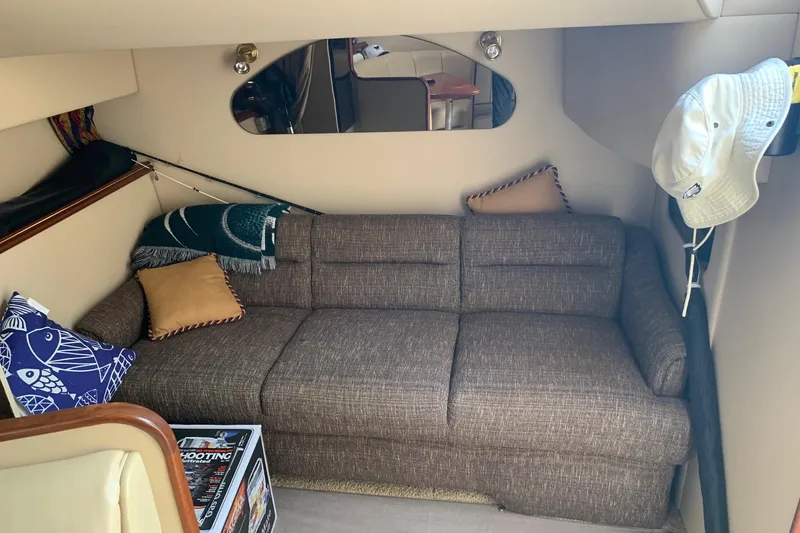 Slide: The Image of Interior of 2002 Cruisers 3275 Express with cozy sofa and decorative pillows. - 28