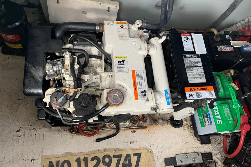 Slide: The Image of Engine compartment of a 2002 Cruisers 3275 Express with Kohler generator and batteries. - 5