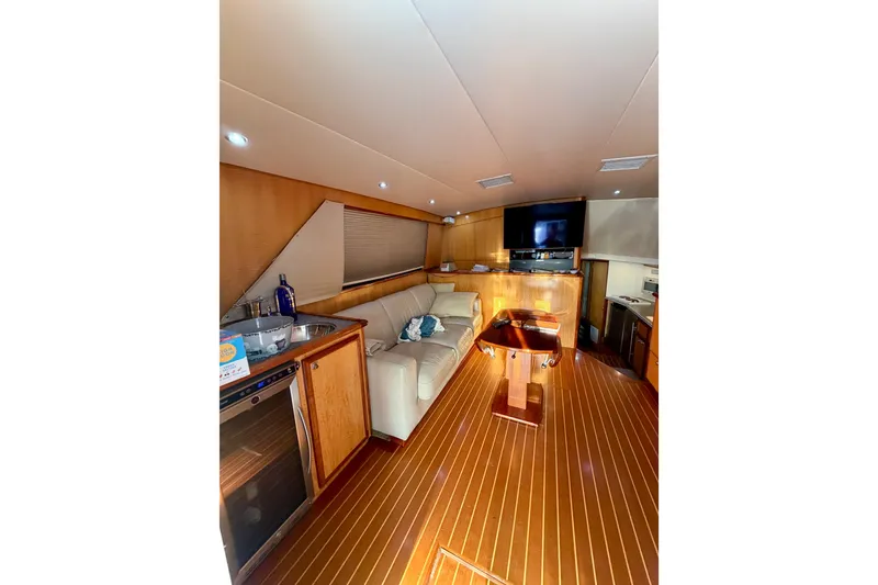 Slide: The Image of Interior of a 1973 Bertram 46.6 yacht with wood flooring and modern amenities. - 19