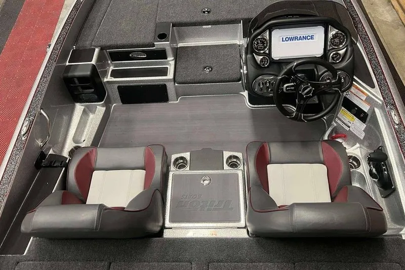 Slide: The Image of 2026 Triton 18 TrX boat interior with dual seats and Lowrance navigation system. - 4