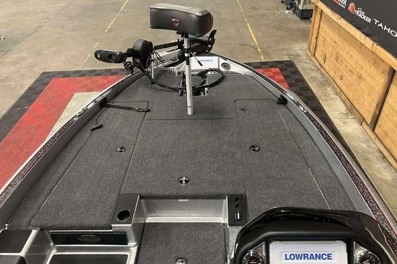 Slide: The Image of 2026 Triton 18 TrX boat deck with Lowrance electronics and trolling motor. - 6
