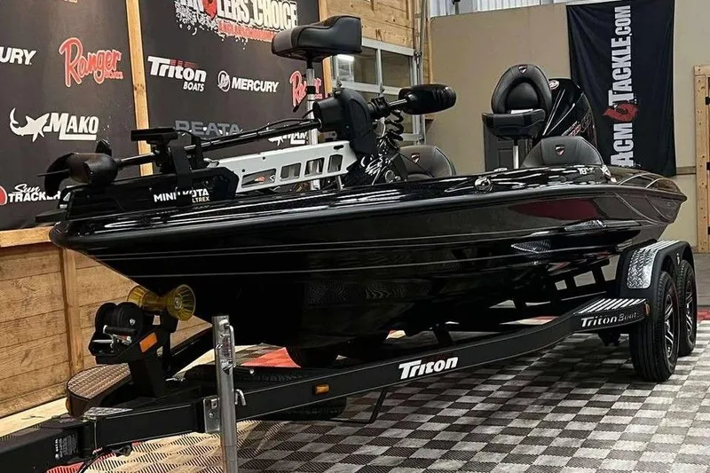 Slide: The Image of 2025 Triton 18 TrX boat on display in showroom with promotional banners. - 4