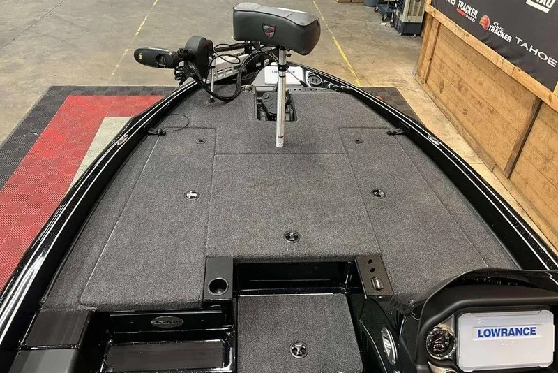 Slide: The Image of 2025 Triton 18 TrX boat interior with Lowrance system and trolling motor. - 5