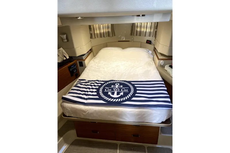 Slide: The Image of Cozy bedroom interior of 2022 Ranger Tugs 43-CB with nautical-themed decor. - 28
