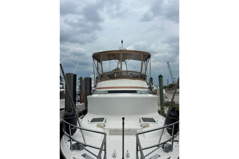 Slide: The Image of 2022 Ranger Tugs 43-CB yacht docked under cloudy skies. - 12