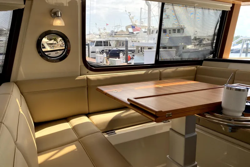 Slide: The Image of 2022 Ranger Tugs R-43 CB deck with fenders and seating area. - 26