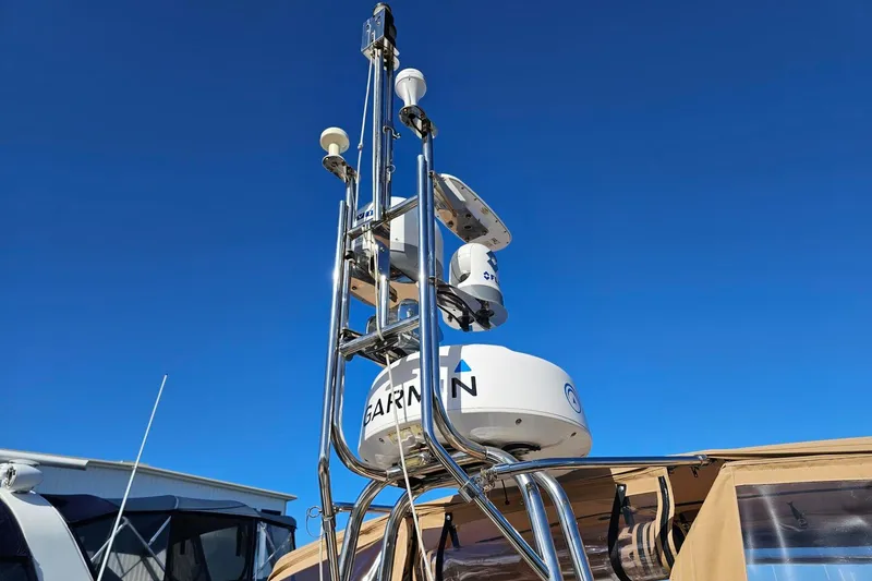 Slide: The Image of Radar and antenna equipment on 2022 Ranger Tugs R-43 CB against clear blue sky. - 31