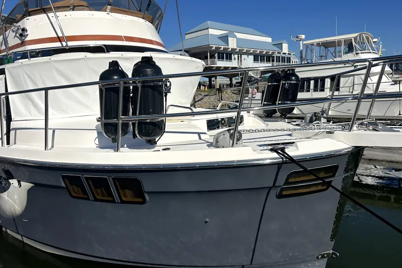 Slide: The Image of 2022 Ranger Tugs 43-CB yacht docked at marina, featuring sleek design and modern amenities. - 6