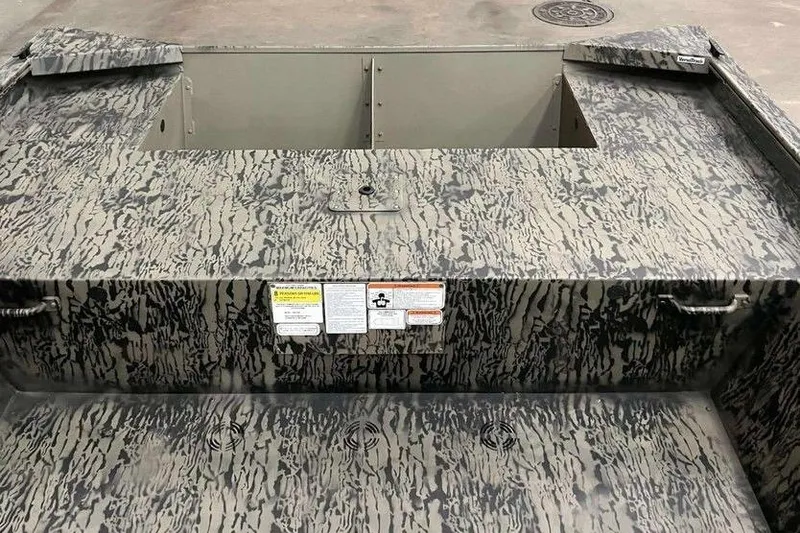 Slide: The Image of 2026 Tracker Grizzly 1860 Utility boat with camouflage pattern and open storage compartment. - 3