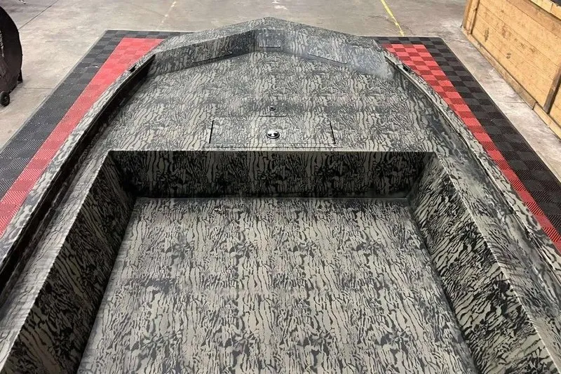 Slide: The Image of 2026 Tracker Grizzly 1860 Utility boat interior with camouflage pattern. - 6