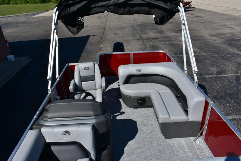 Slide: The Image of 2026 Sun Tracker Party Barge 18 DLX interior with gray seating and canopy. - 10