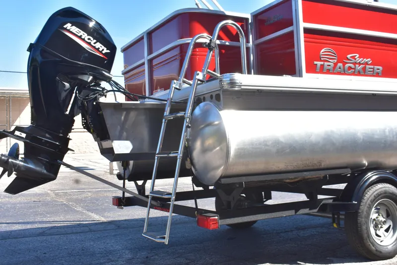 Slide: The Image of 2026 Sun Tracker Party Barge 18 DLX with Mercury outboard motor and ladder. - 3