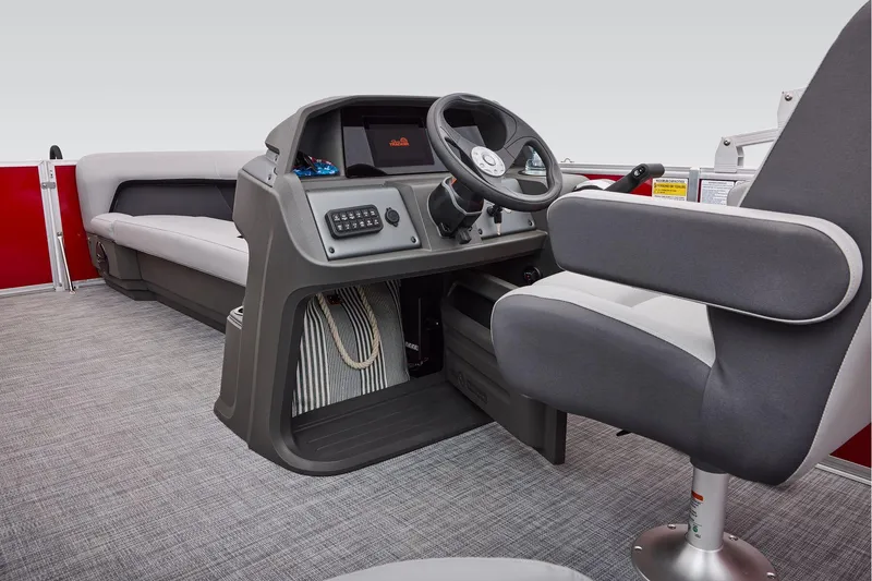 Slide: The Image of Manufacturer Provided Image: 2026 Sun Tracker Party Barge 18 DLX interior with steering console and seating. - 43