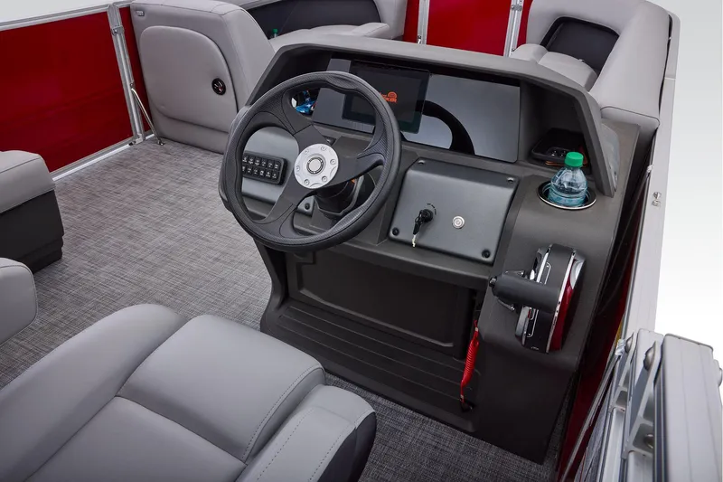 Slide: The Image of Manufacturer Provided Image: 2026 Sun Tracker Party Barge 18 DLX interior with steering wheel and control panel. - 45