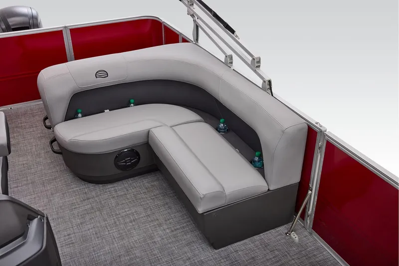 Slide: The Image of Manufacturer Provided Image: 2026 Sun Tracker Party Barge 18 DLX interior with gray seating and red paneling. - 52