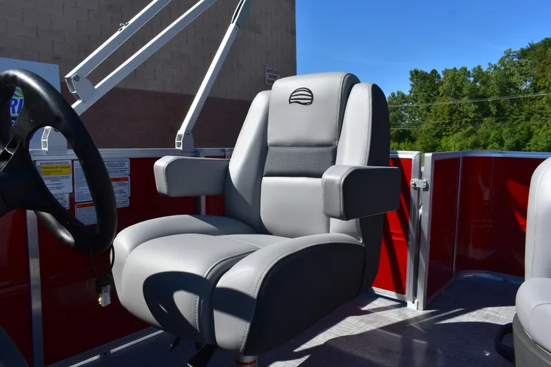 Slide: The Image of 2026 Sun Tracker Party Barge 18 DLX captain's chair with armrests and steering wheel. - 69