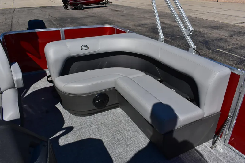 Slide: The Image of 2026 Sun Tracker Party Barge 18 DLX with gray seating and red accents on deck. - 71