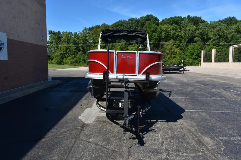 Slide: The Image of 2026 Sun Tracker Party Barge 18 DLX pontoon boat in parking lot, front view. - 85