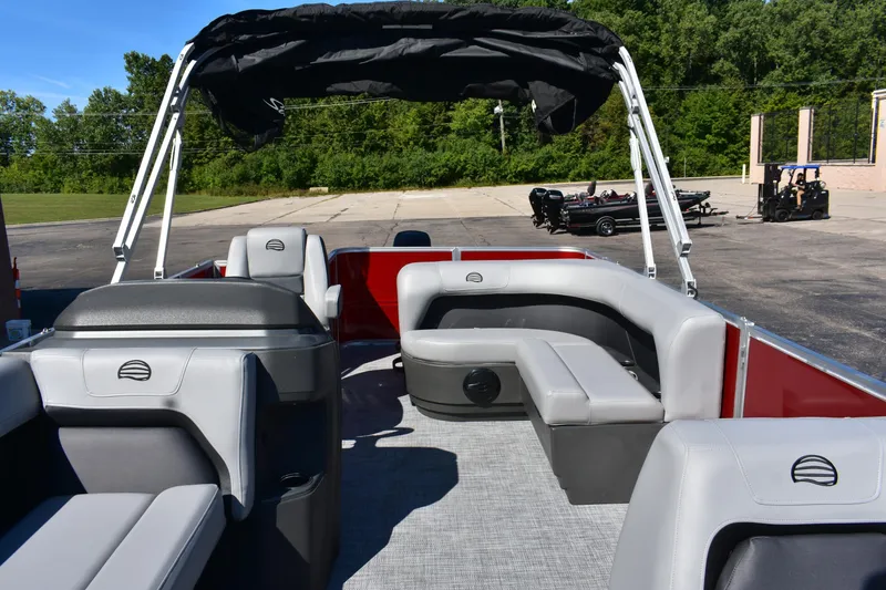 Slide: The Image of 2026 Sun Tracker Party Barge 18 DLX pontoon boat with gray seating and canopy. - 87