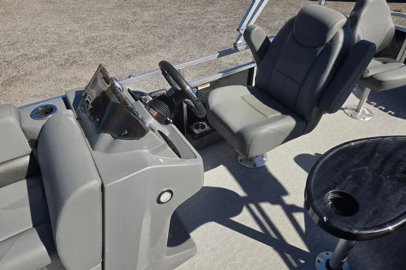 Slide: The Image of 2020 Avalon Venture Fish N Cruise boat interior with steering console and seating. - 12