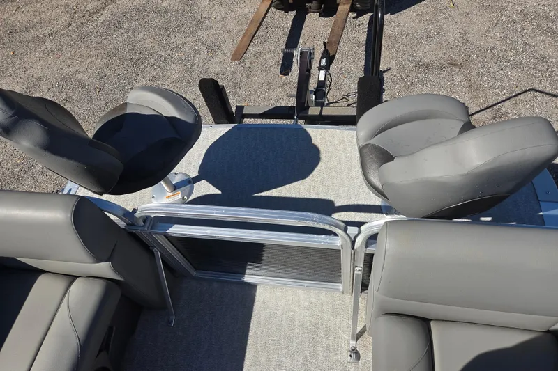 Slide: The Image of 2020 Avalon Venture Fish N Cruise boat interior with gray seating and carpeted floor. - 14
