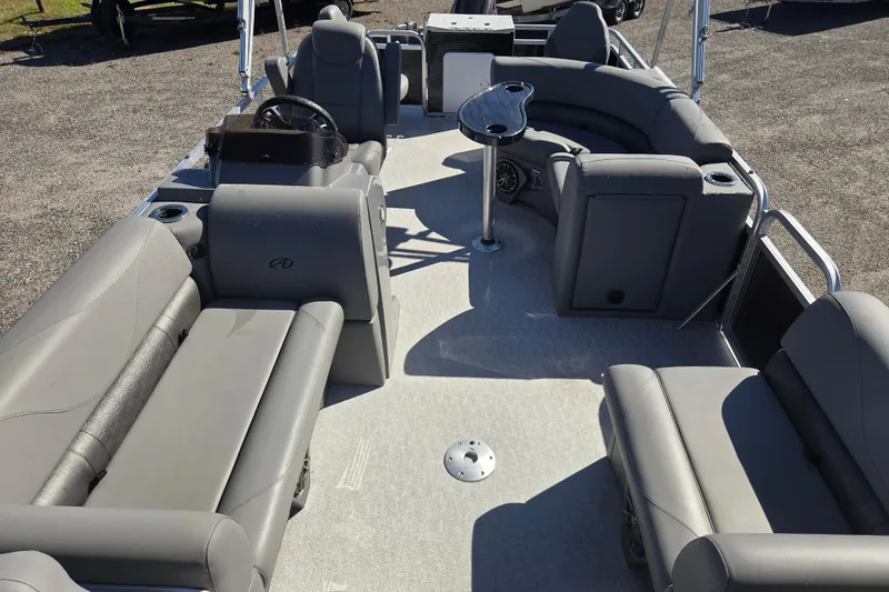 Slide: The Image of 2020 Avalon Venture Fish N Cruise 20' pontoon boat interior with gray seating and steering console. - 15