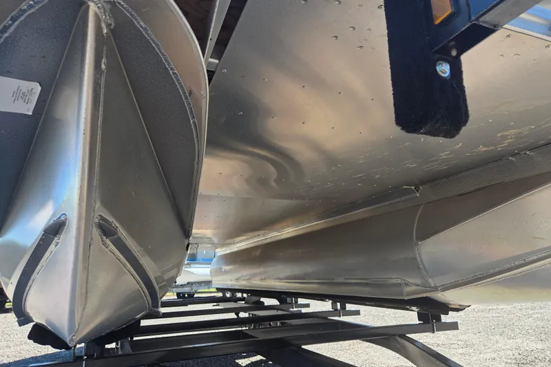 Slide: The Image of Underneath view of a 2020 Avalon Venture Fish N Cruise 20' pontoon boat. - 2
