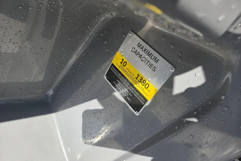 Slide: The Image of 2020 Avalon Venture Fish N Cruise boat capacity label with water droplets. - 7